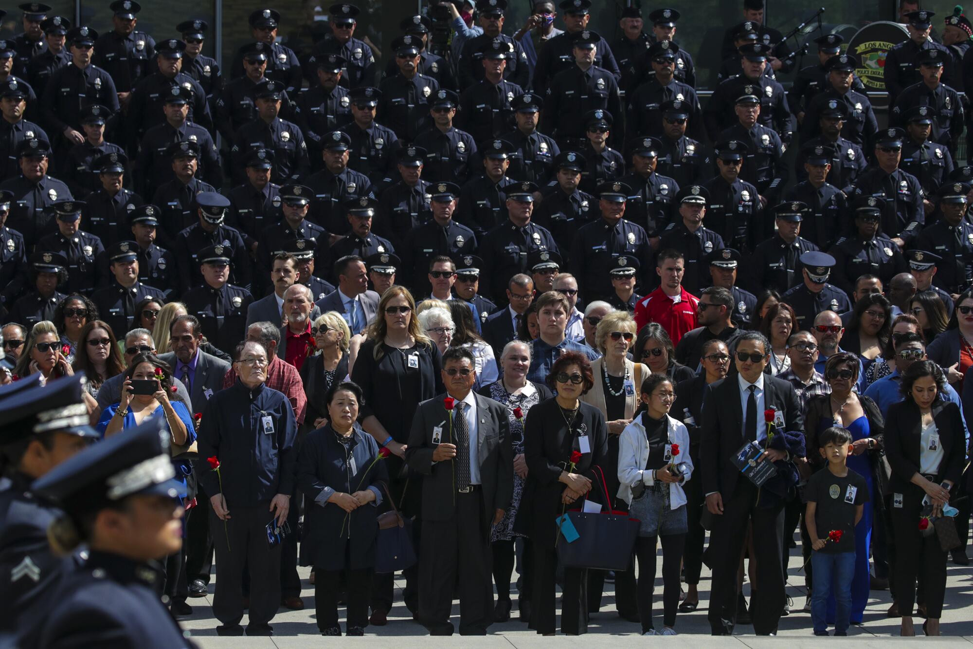 Family members of fallen officers assemble with police officers 