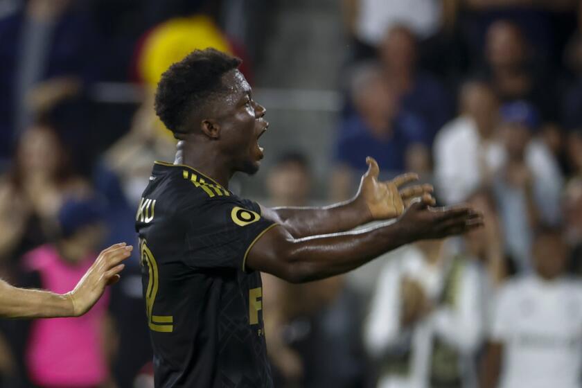 Los Angeles FC forward Kwadwo Opoku (22) celebrates his goal during an MLS soccer match against the Seattle Sounders Friday, July 29, 2022, in Los Angeles. (AP Photo/Ringo H.W. Chiu)