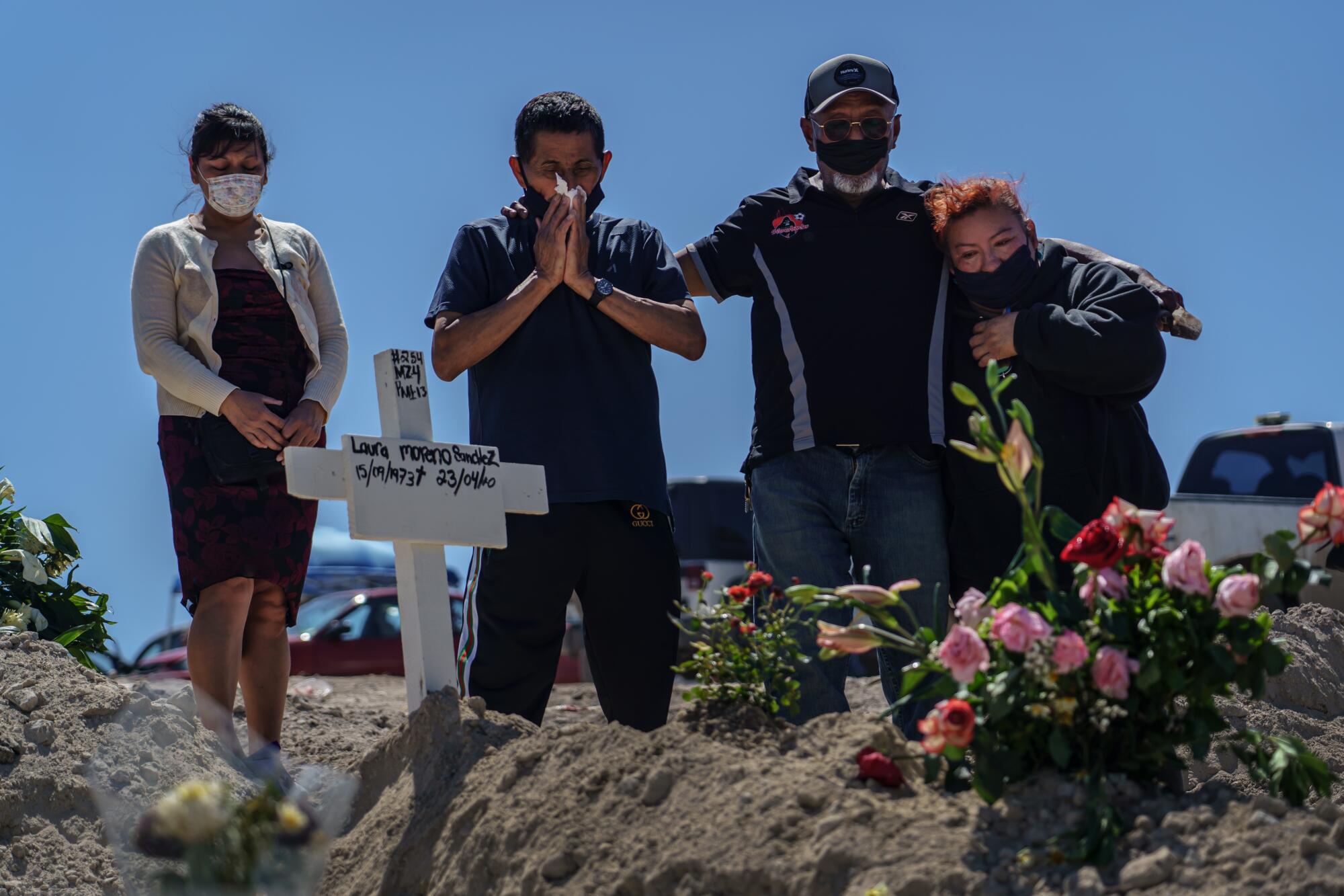 From left, Bernadina Cruz Perez, Fredy Villa Suerte Hernandez, Dominguez Hernandez and Cleotilde Hernandez mourn the death of Laura Moreno Sanchez, 49. 
