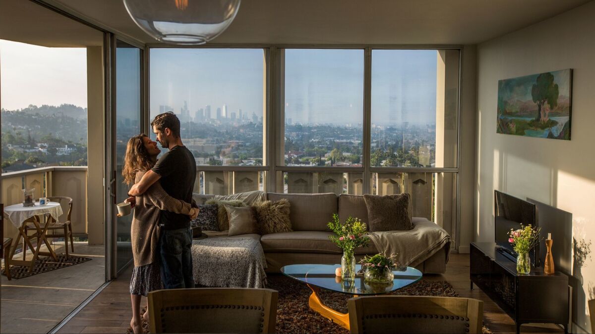 ONE TIME USE - LOSANGELES-CA-APRIL 7, 2017: Actress Aleksa Palladino and cinematographer Needham Smith III are seen at home in their 1960s condominium in the iconic Los Feliz Tower in Los Angeles, California, April 7, 2017. One of the two original bedrooms now serves as a music room. The couple wanted a low maintenance home close to Hollywood. Not wanting to sacrifice on design, and with the desire for something original and modern, they turned to architecture firm Hsu McCullough to revamp their dated condo. (David McNew / For The Times)