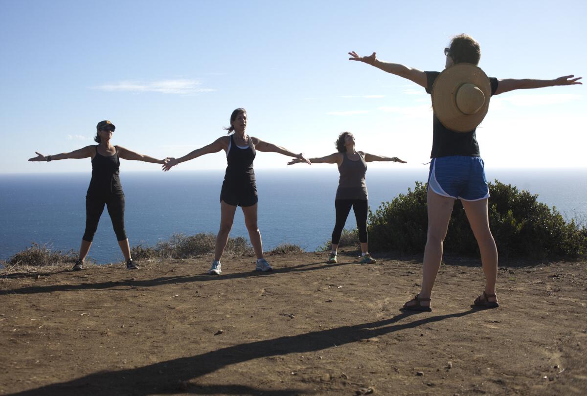 Yogis stretch in Malibu in September. A federal appeals court decided Thursday that yoga poses may not receive copyright protection.