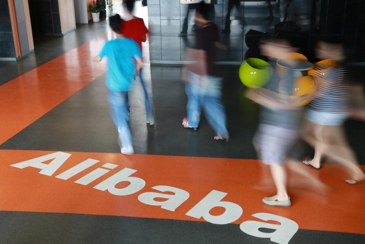 Alibaba's second-quarter net income fell 39%, but sales surged.