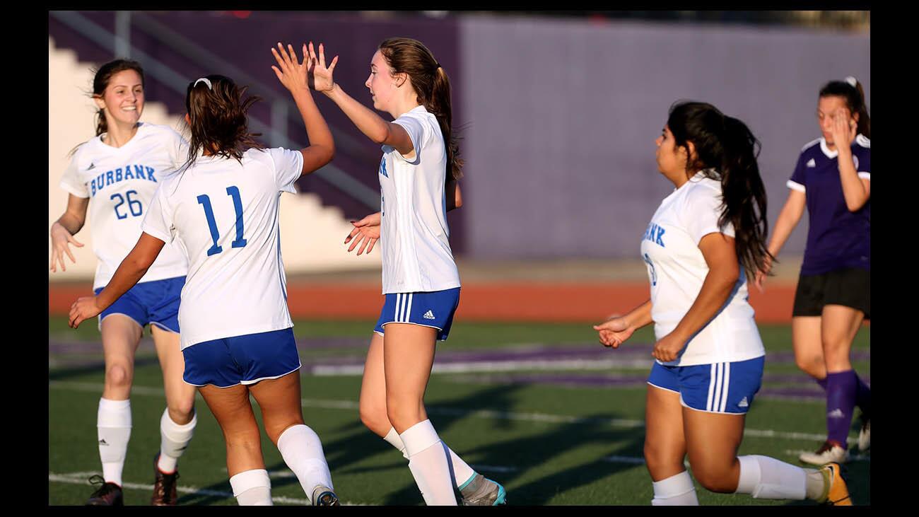 Burbank High School girls' soccer player #3 Marie Chase celebrates as goal in game vs. Hoover High School, in Glendale on Friday, Dec. 21, 2018.