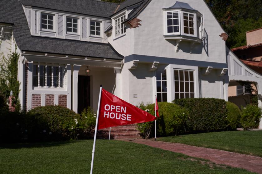 LOS ANGELES, CA - SEPTEMBER 22: An 'open house' flag is displayed outside a single family home on September 22, 2022 in Los Angeles, California. The U.S. housing market is seeing a slow down in home sales due to the Federal Reserve raising mortgage interest rates to help fight inflation. (Photo by Allison Dinner/Getty Images)