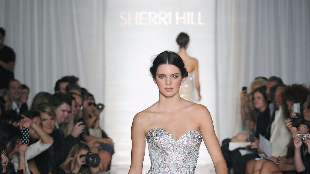 Kendall Jenner, shown at Sherri Hill's show, made her runway debut in September 2011.