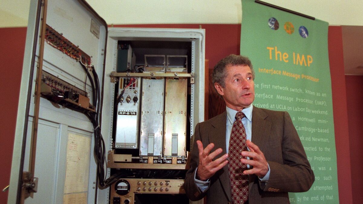 UCLA professor Leonard Kleinrock discusses the Interface Message Processor in Korn Convocation Hall in 1999.