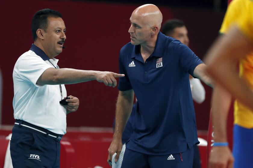 TOKYO, - JULY 30: U.S. volleyball coach John Speraw makes his point with a referee during the game against Brazil. U.S. vs Brazil men's volleyball at Ariake Arena during the Tokyo Olympics.Tokyo Olympics on Friday, July 30, 2021 in Tokyo, {stmens}. (Gary Ambrose / For the Times)