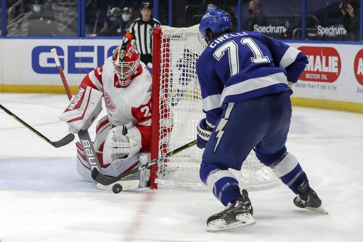 Detroit Red Wings goaltender Thomas Greiss, of Germany, makes a save against Tampa Bay Lightning's Anthony Cirelli during the second period of an NHL hockey game Sunday, April 4, 2021, in Tampa, Fla. (AP Photo/Mike Carlson)