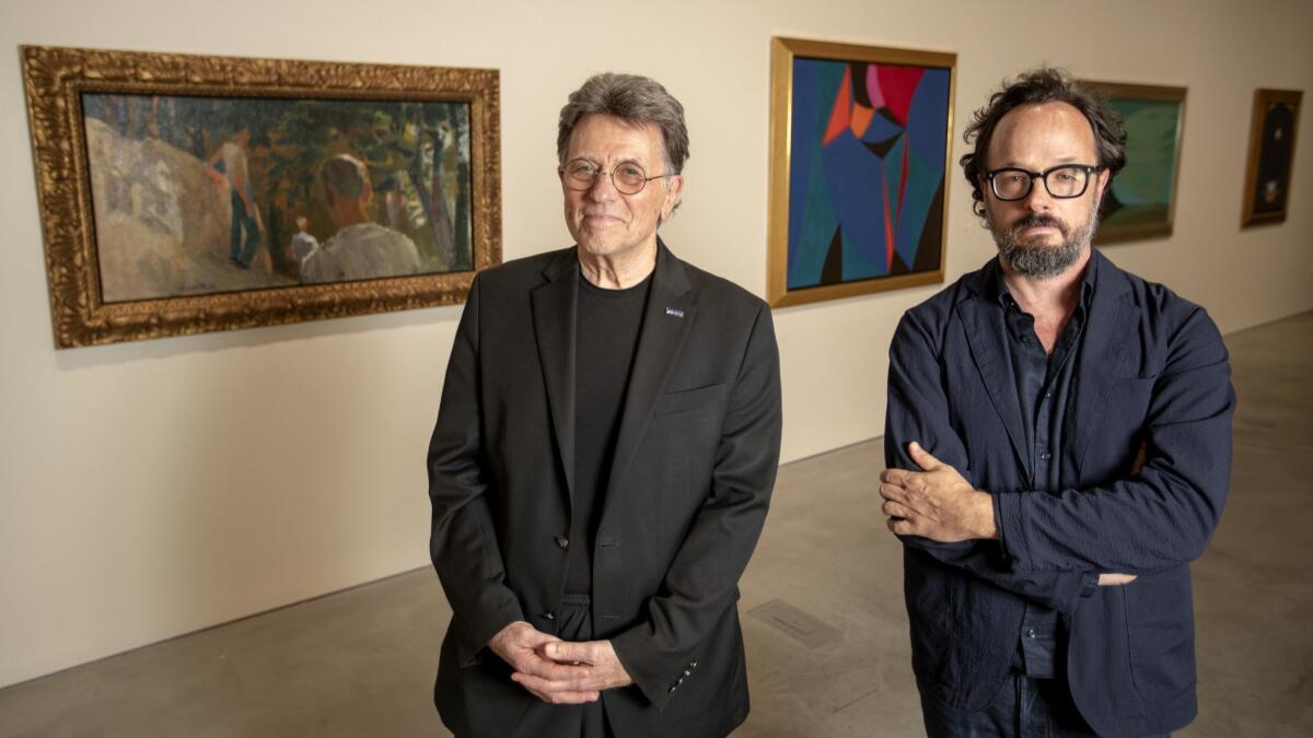"First Glimpse: Introducing the Buck Collection" co-curators Stephen Barker, left, and Kevin Appel at the new collection of California paintings.