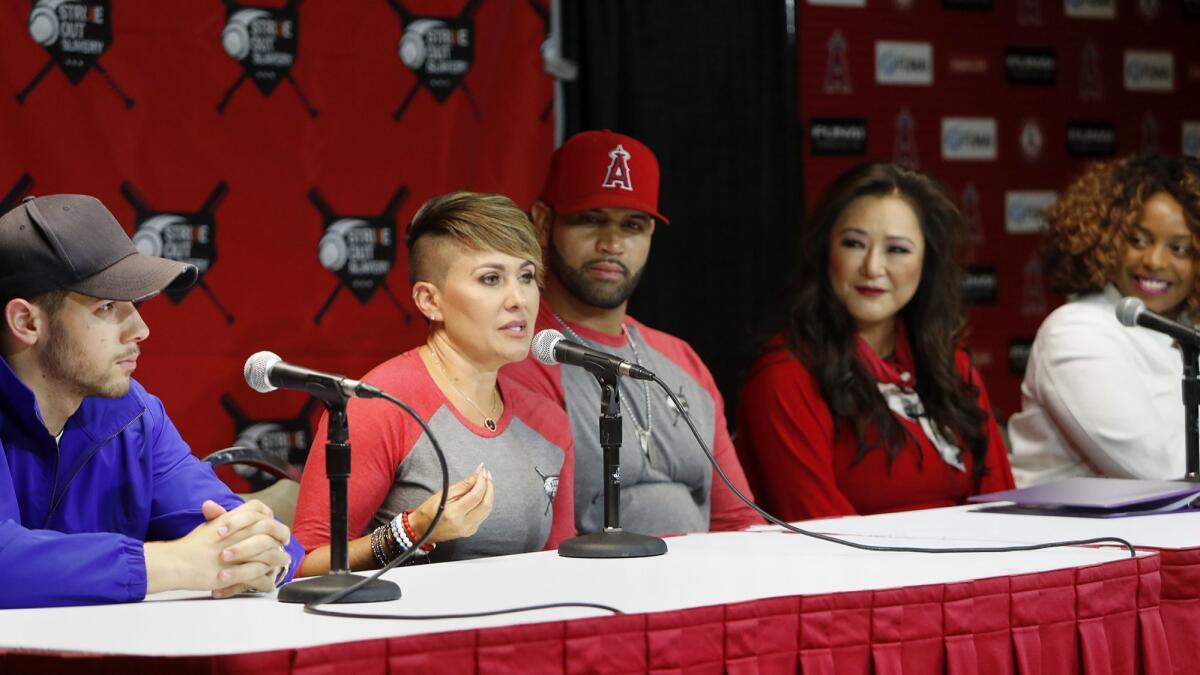 Deidre Pujols speaks at a news conference announcing the second Strike Out Slavery Day at Angel Stadium. The panel included, from left, singer Nick Jonas and Pujols’ husband, Albert Pujols of the Angels.