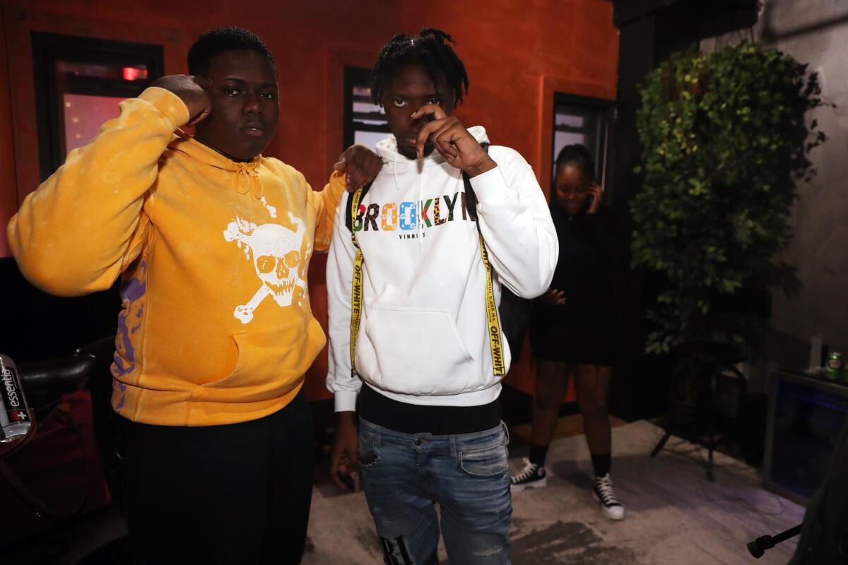 Rappers Sheff G and Sleepy Hallow posing in hoodies at release party event in New York