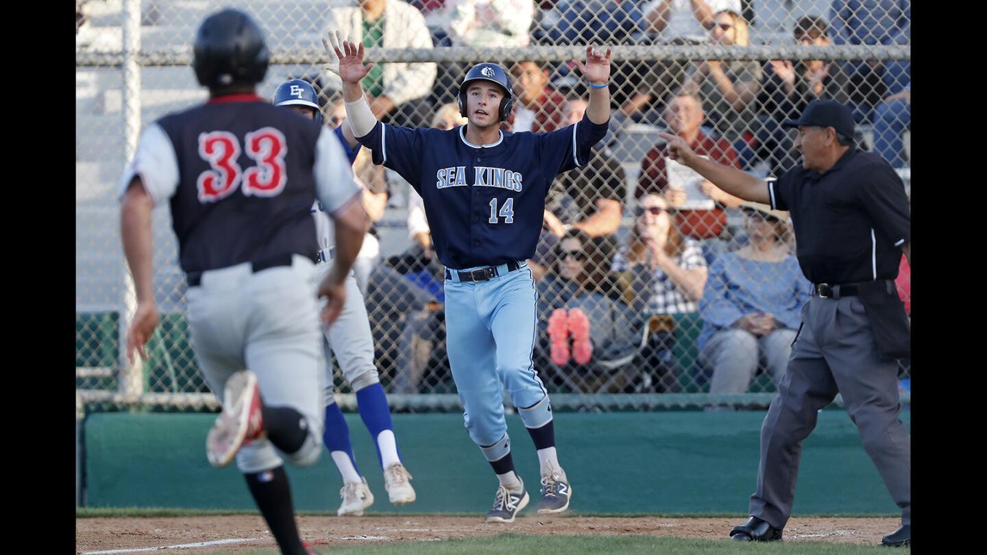 Corona del Mar High’s J.T. Schwartz (14) scores first for the South All-Stars during the first inning in the Kiwanis Club of Greater Anaheim's 51st Orange County High School All-Star Baseball Game for seniors at La Palma Park's Dee Fee Field in Anaheim on Tuesday, June 5.