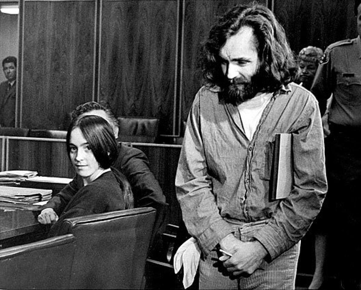 Charles Manson and follower Susan Atkins, seated, appear in court in Santa Monica in 1970.