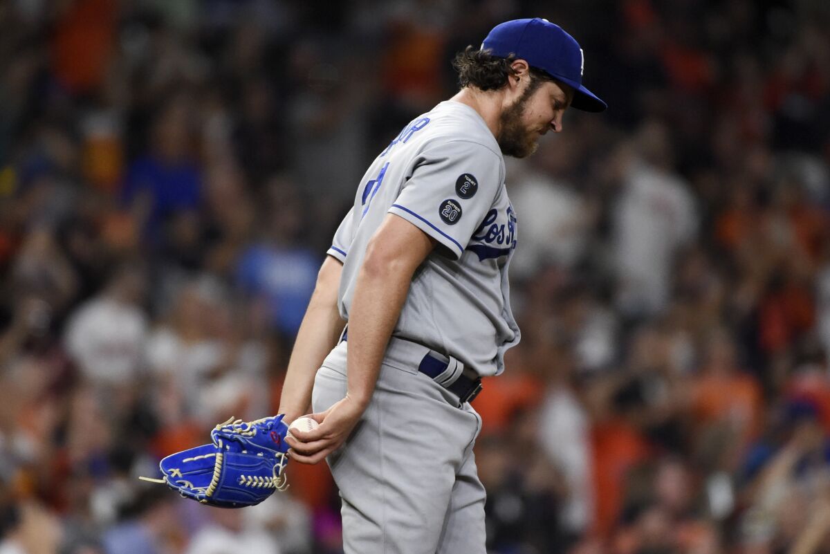 Dodgers pitcher Trevor Bauer walks back to the mound after giving up a solo home run.