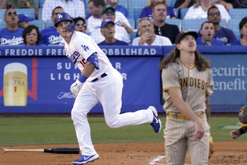 Dodgers catcher Will Smith hits a solo home run from San Diego Padres pitcher Mike Clevinger.