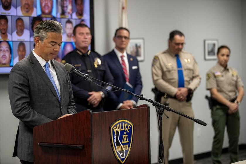 RIVERSIDE, CA - MAY 26, 2022: California Attorney General Rob Bonta announces the results of a multiagency effort to takedown violent street gang members in Riverside County on May 26, 2022 in Riverside, California. As part of the operation, 17 individuals were arrested, 55 firearms were seized, including six ghost guns and three assault rifles. Also confiscated were two pounds of cocaine, two pounds of heroin, a half-pound of methamphetamine and 200 MDMA pills.(Gina Ferazzi / Los Angeles Times)
