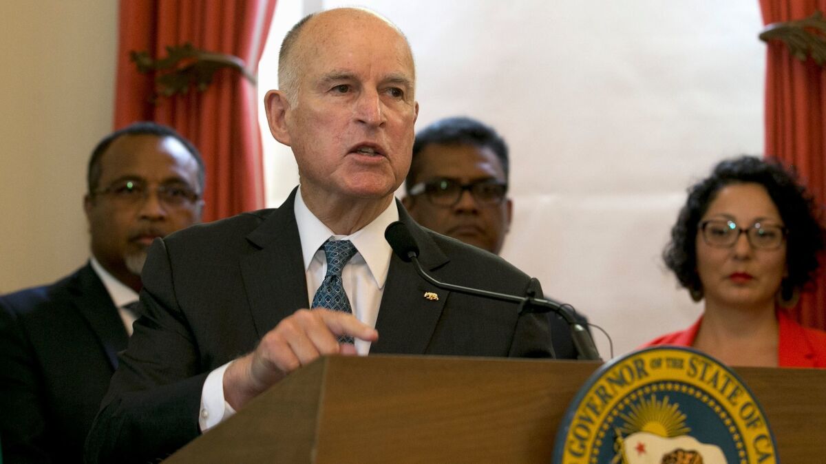 Gov. Jerry Brown, shown at a news conference after he was named special advisor at a United Nations summit on climate change, is pushing to extend the state's cap-and-trade program.