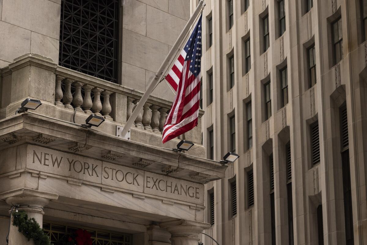 An American flag hangs from the New York Stock Exchange building.