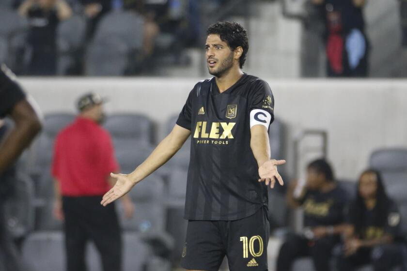 Los Angeles FC forward Carlos Vela (10) reacts to a call during an MLS soccer match between the Los Angeles FC and the Vancouver Whitecaps in Los Angeles, Saturday, July 24, 2021. (AP Photo/Ringo H.W. Chiu)