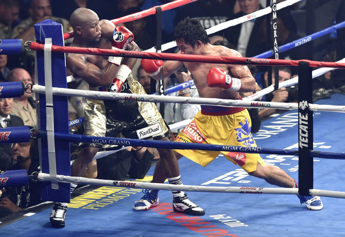 Manny Pacquiao gets Floyd Mayweather Jr. in the corner during the 10th round.