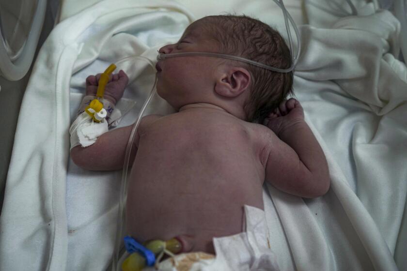 A Palestinian baby boy, not yet named, who was delivered prematurely after his mother Ola al-Kurd was killed in an Israeli strike, lies in an incubator at a hospital in Deir al-Balah, Friday, July 19, 2024. The latest casualties follow a rare moment of hope in war ravaged Gaza, after a medical teams recovered a live baby from a heavily pregnant Palestinian mother killed in an airstrike that hit her home in Nuseirat late Thursday evening. The still-unnamed newborn is stable but has suffered from a shortage of oxygen and has been placed in an incubator, doctors said. (AP Photo/Abdel Kareem Hana)
