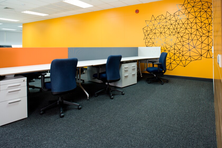 Empty chairs and desks in an office.