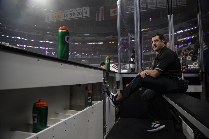 Kings trainer Chris Kingsley watches the team skate during warmups before a game against the Edmonton Oilers at the Staples Center on Nov. 21. Kingsley is a cancer survivor.
