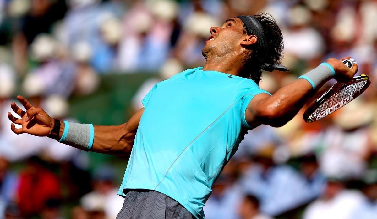 Rafael Nadal prepares to hit an overhead shot against Andy Murray in a straight-set victory in the semifinals of the French Open on Friday.