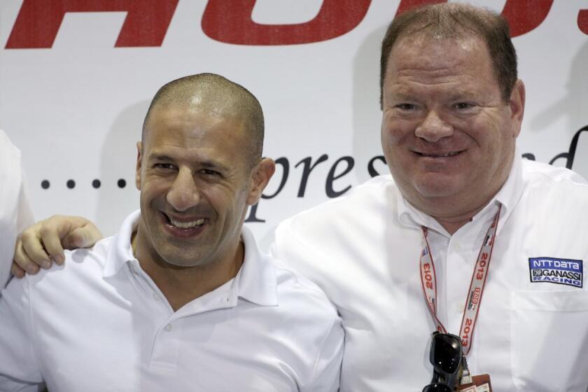 Chip Ganassi, right, with driver Tony Kanaan at a news conference on Friday.