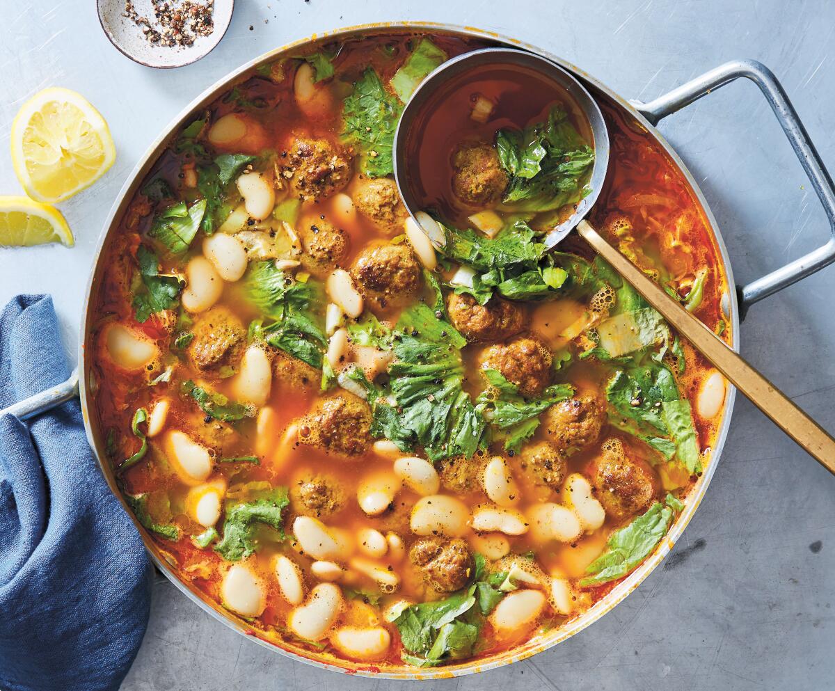 Spiced lamb meatballs flavor this simple soup teeming with greens and beans.