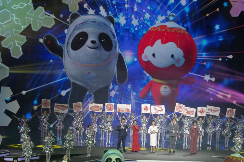 Beijing 2022 Winter Olympic Mascot Bing Dwen Dwen, left and 2022 Winter Paralympic Games mascot Shuey Rong Rong are revealed during a ceremony held at the Shougang Ice Hockey Arena in Beijing on Tuesday, Sept. 17, 2019. (AP Photo/Ng Han Guan)