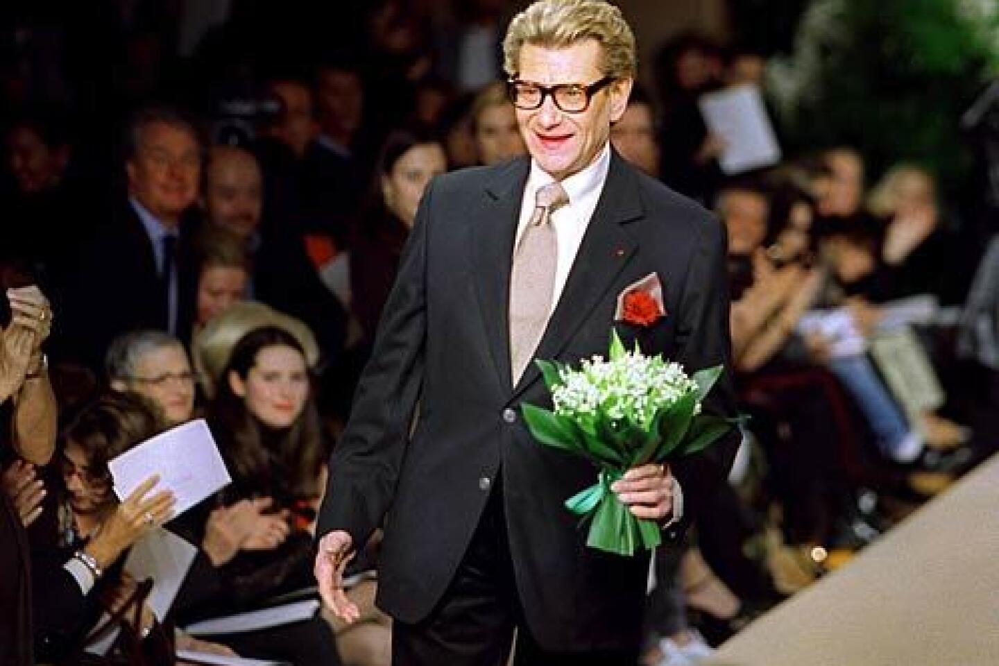 French fashion designer Yves Saint Laurent , at the House of Dior