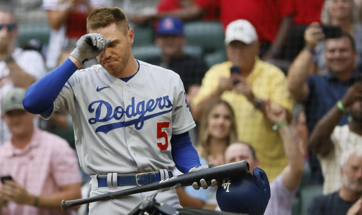 Los Angeles Dodgers' Freddie Freeman reacts to a standing ovation.