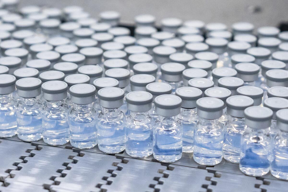 Vials of Pfizer's COVID-19 vaccine on a production line in Kalamazoo, Mich.