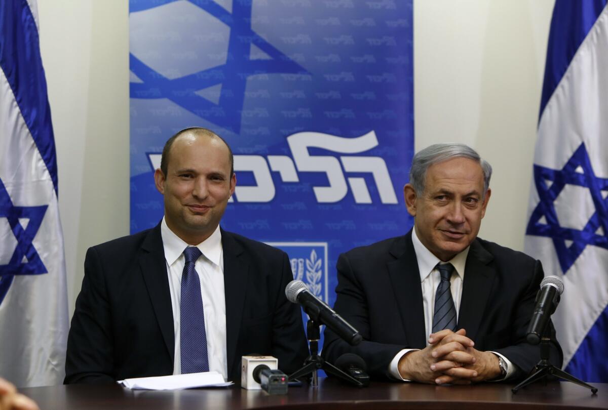 Israeli Prime Minister Benjamin Netanyahu, right, and Naftali Bennett, the head of the right-wing Jewish Home party, at a news conference May 6 at the Knesset in Jerusalem to announce the formation of a coalition government.