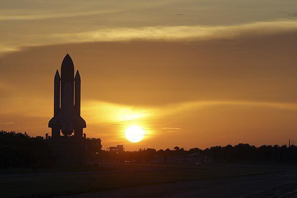 Space shuttle at sunrise