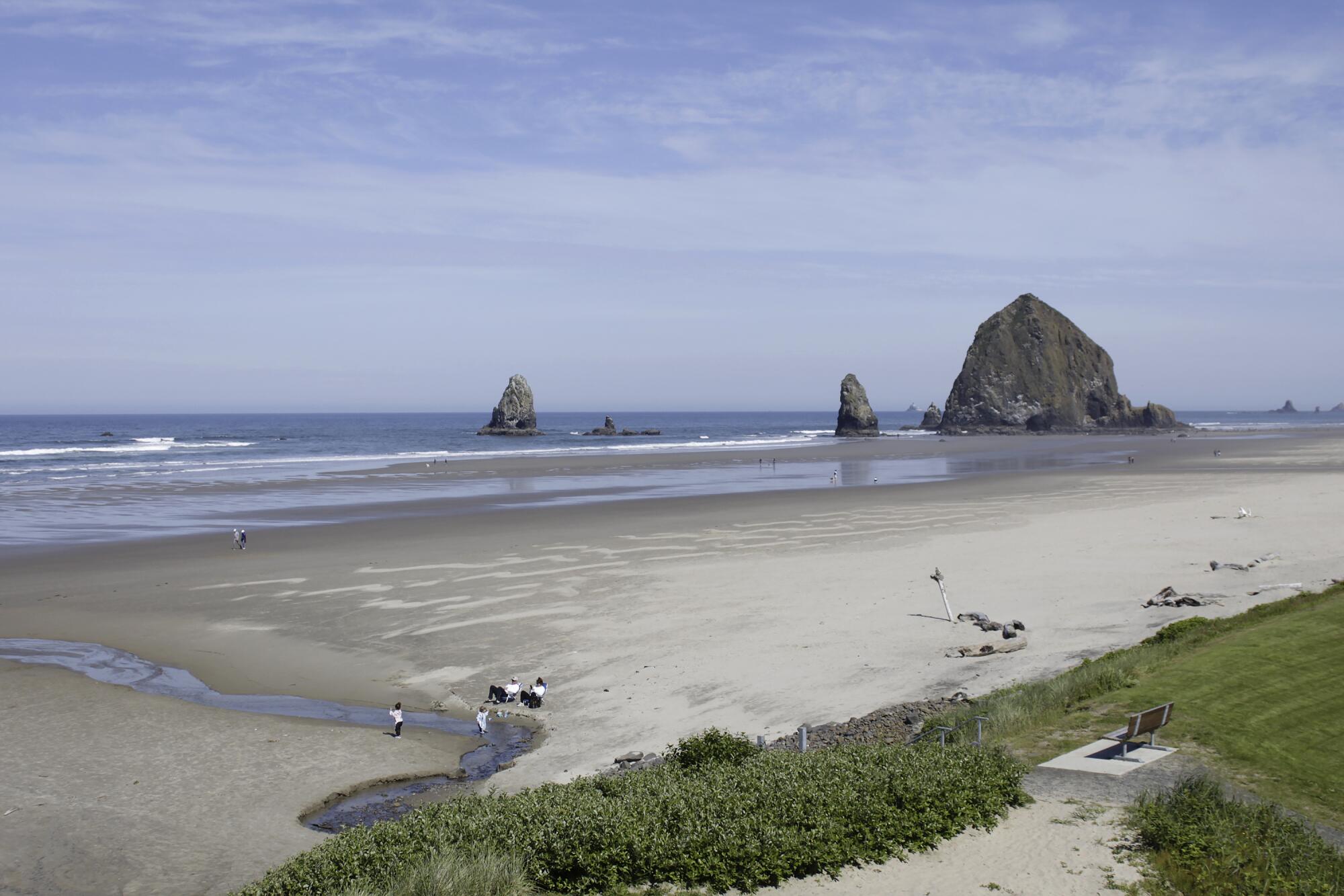 Haystack Rock is seen in the distance from a balcony of The Ocean Lodge.