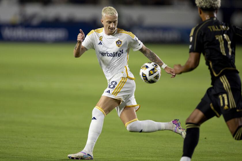 Galaxy forward Marco Reus, left, controls the ball in front of LAFC midfielder Timothy Tillman.