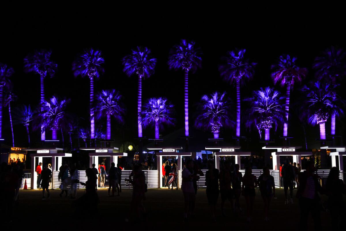 Trees surrounding the Polo field were aglow in purple, a desert tribute to Prince following his death, on opening night of Weekend 2 of the Coachella Valley Music and Arts Festival in Indio on April 22, 2016.