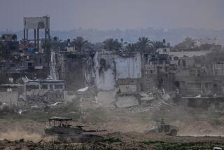 Israeli soldiers operate inside the Gaza Strip, as seen from southern Israel, Tuesday, Feb. 13, 2024. The army is battling Palestinian militants across Gaza in the war ignited by Hamas' Oct. 7 attack into Israel. (AP Photo/Ariel Schalit)