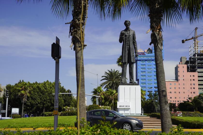 Tijuana, Baja California - July 13: Traffic flows around the Abraham Lincoln statue at Glorieta Paseo de los Heroes in Zona Rio on Wednesday, July 13, 2022 in Tijuana, Baja California. (Alejandro Tamayo / The San Diego Union-Tribune)