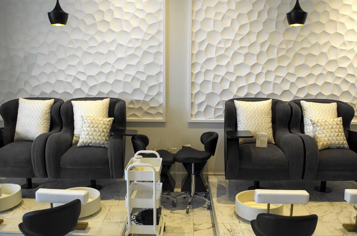 Comfy chairs and pillows make up the luxury nail salon Polished Perfect.