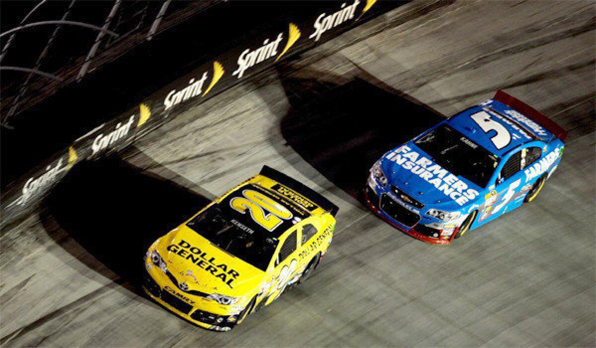 Matt Kenseth, left, edged Kasey Kahne, right, for the victory at the Irwin Tools Night Race at Bristol Motor Speedway on Saturday.