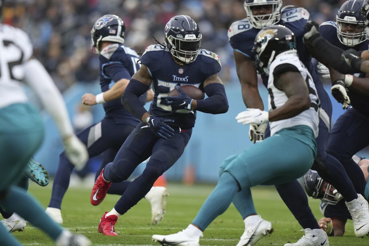 Tennessee Titans running back Derrick Henry carries the ball against the Jacksonville Jaguars on Dec. 11.