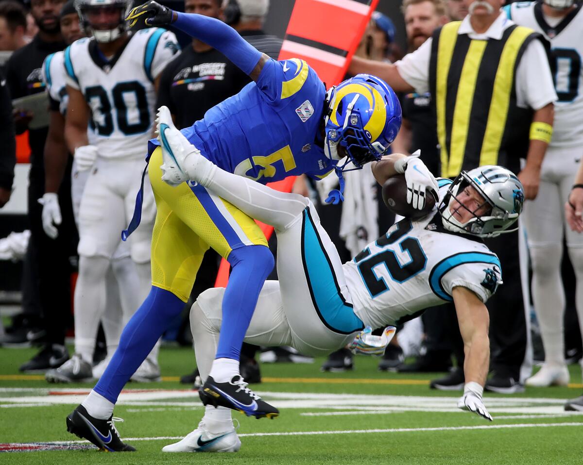 Rams cornerback Jalen Ramsey puts a big hit on Carolina running back Christian McCaffrey in the third quarter.