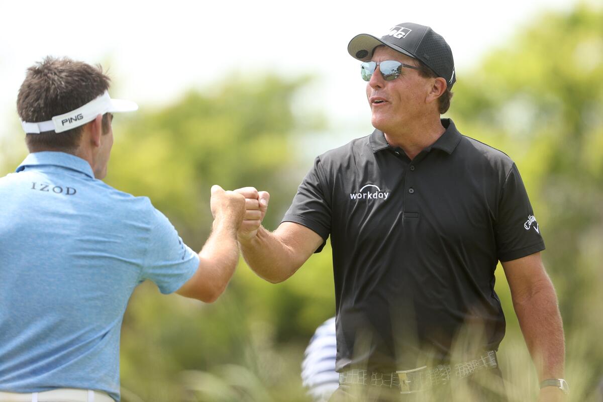 Louis Oosthuizen of South Africa and Phil Mickelson of the United States 
