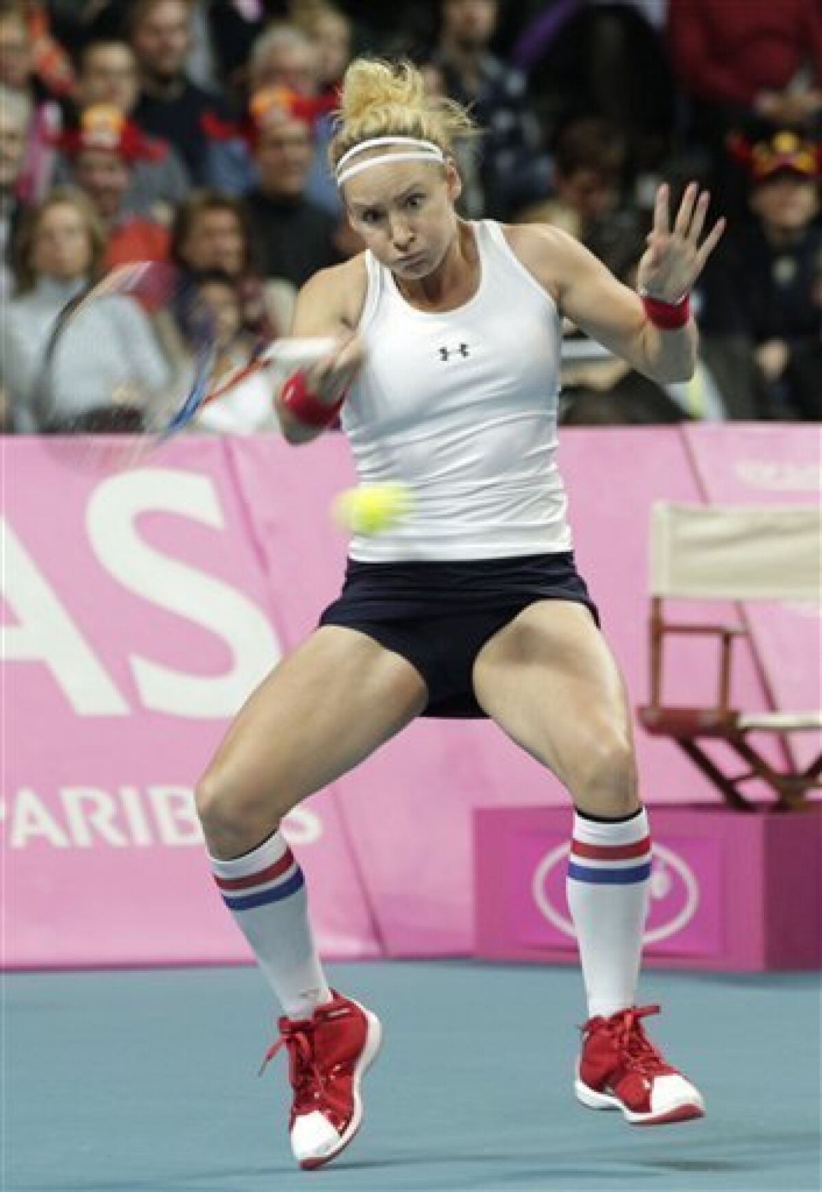 US player Bethanie Mattek-Sands returns the ball to Belgium's Yanina Wickmayer during the World Group Fed Cup match in Antwerp, Belgium, Saturday, Feb. 5, 2011. (AP Photo/Yves Logghe)