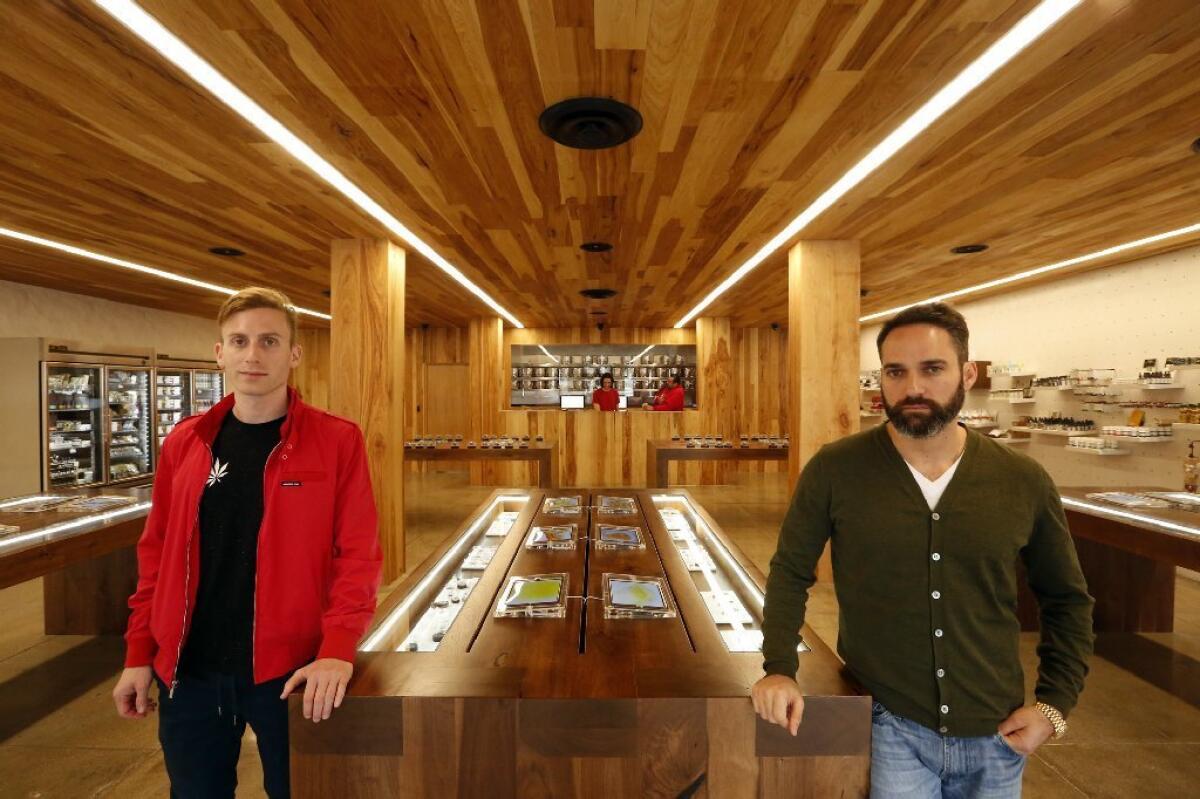 Andrew Modlin, left, co-founder and chief operating officer, and Adam Bierman, co-founder and chief executive, inside MedMen cannabis dispensary in West Hollywood. One inspiration for the shop was the Apple store.