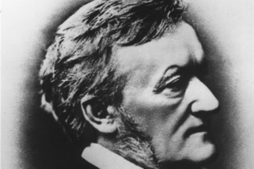 A black and white image shows the composer Richard Wagner in profile