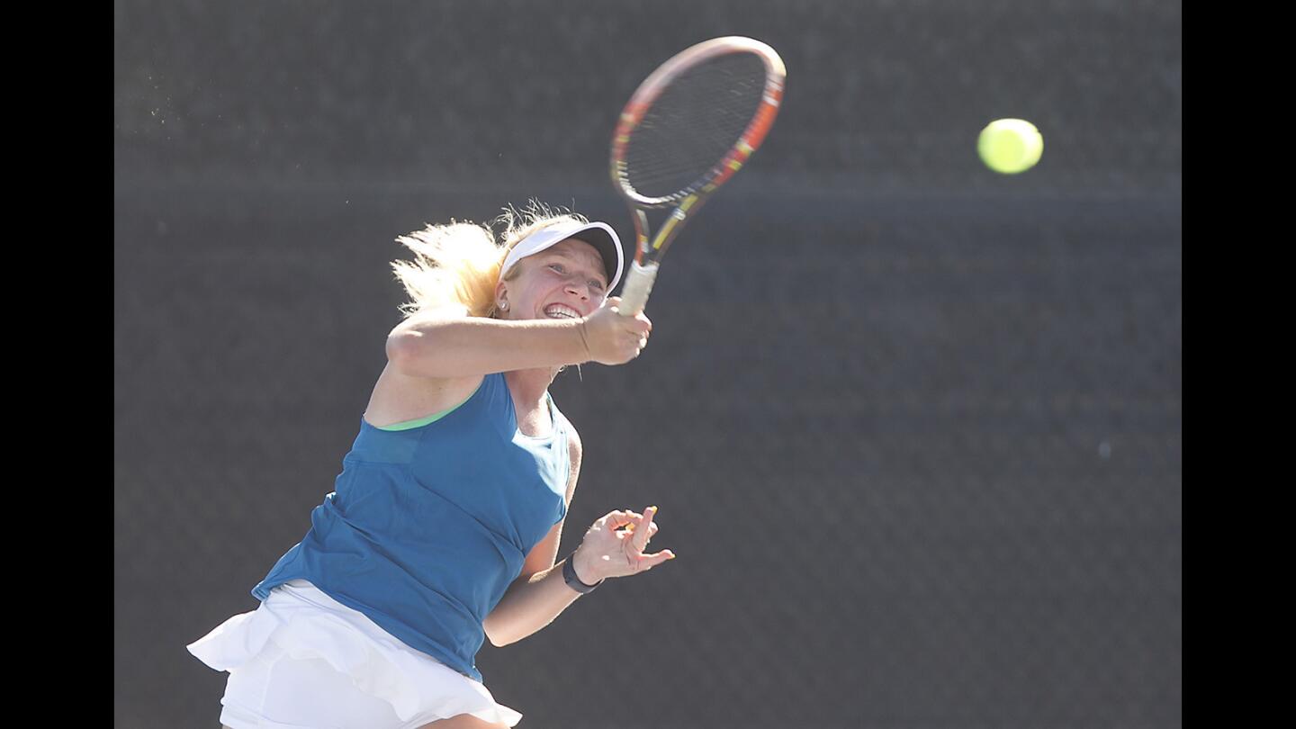 CDM's Kristina Evloeva hits a winning forehand in battle of the day's number one seed singles against Beckman.